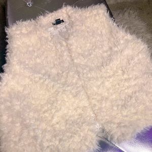 Slightly off white sleeveless fluffy vest